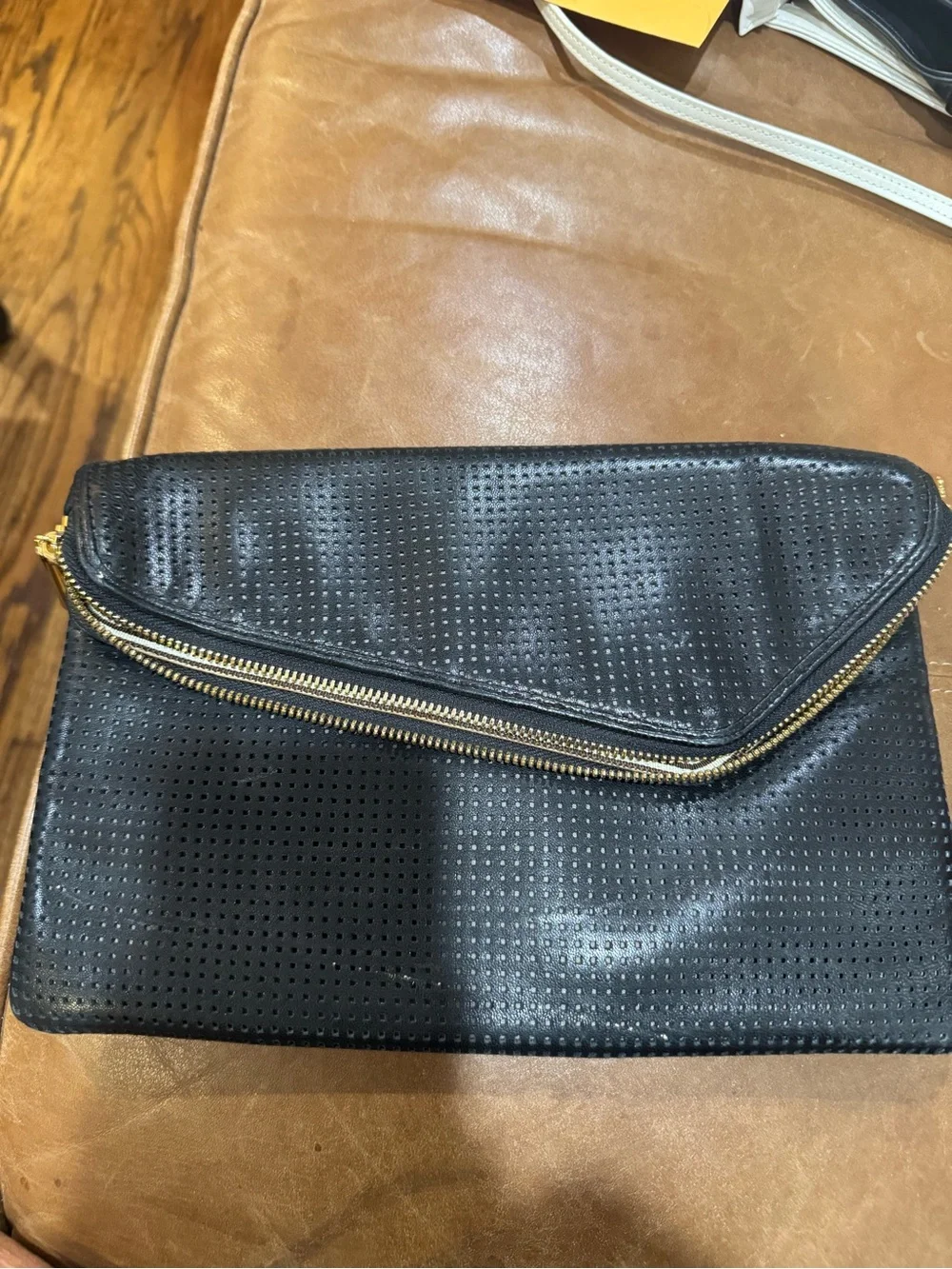 henri bendel Black Perforated Envelope Clutch with Gold Zip Accent
